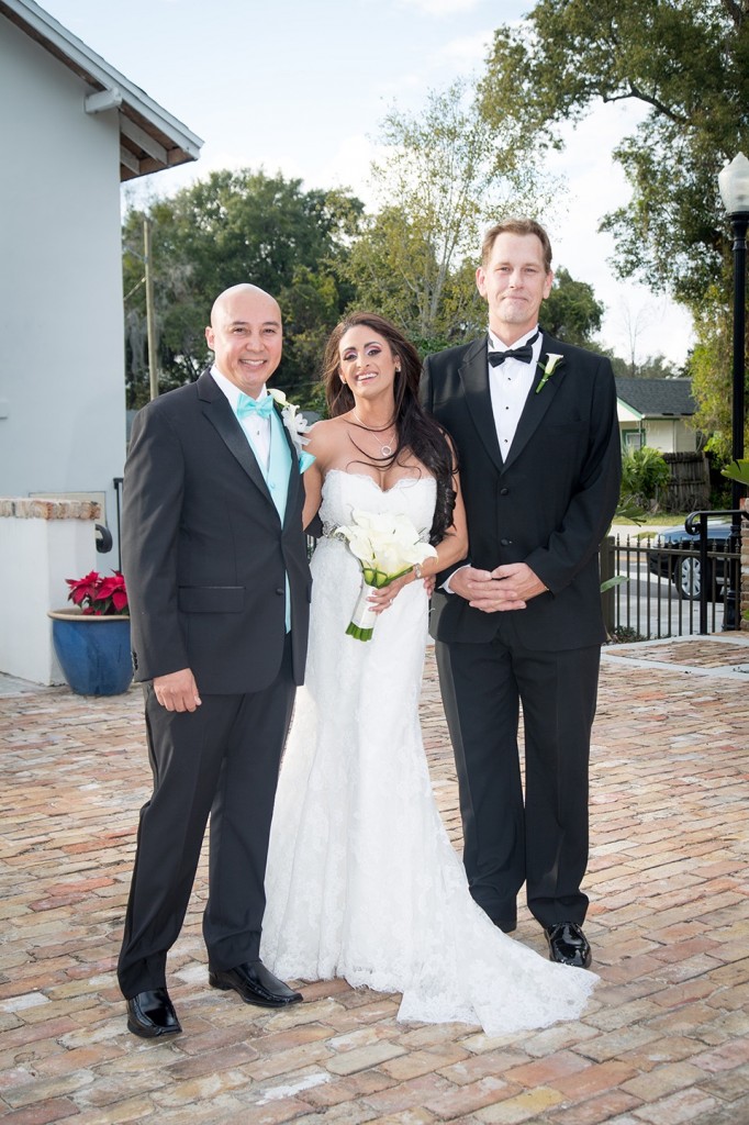 Photo with the best man in the courtyard of their historic Winter Park wedding venue